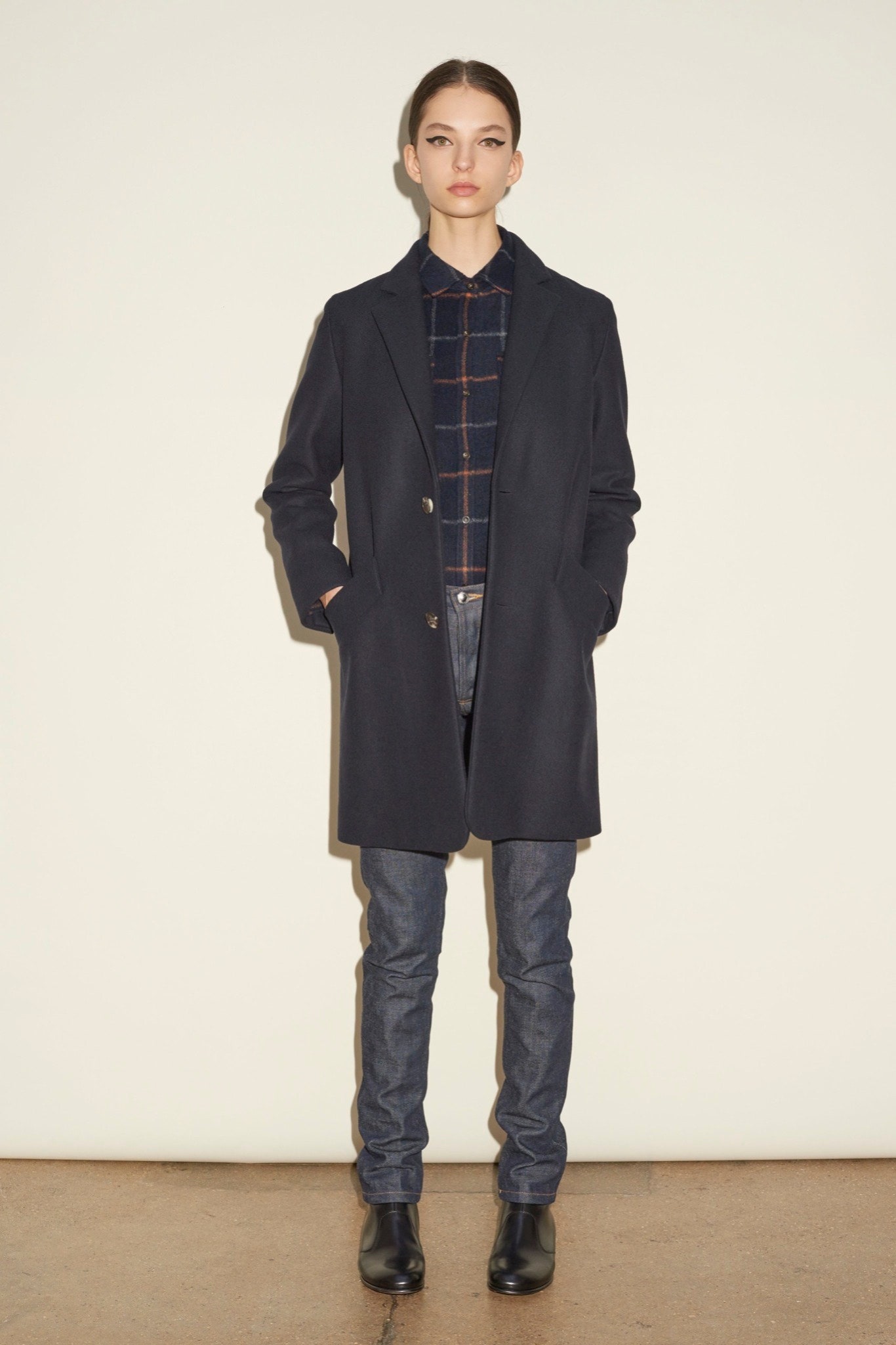 black wool long-sleeve collared structured buttoned pockets coat