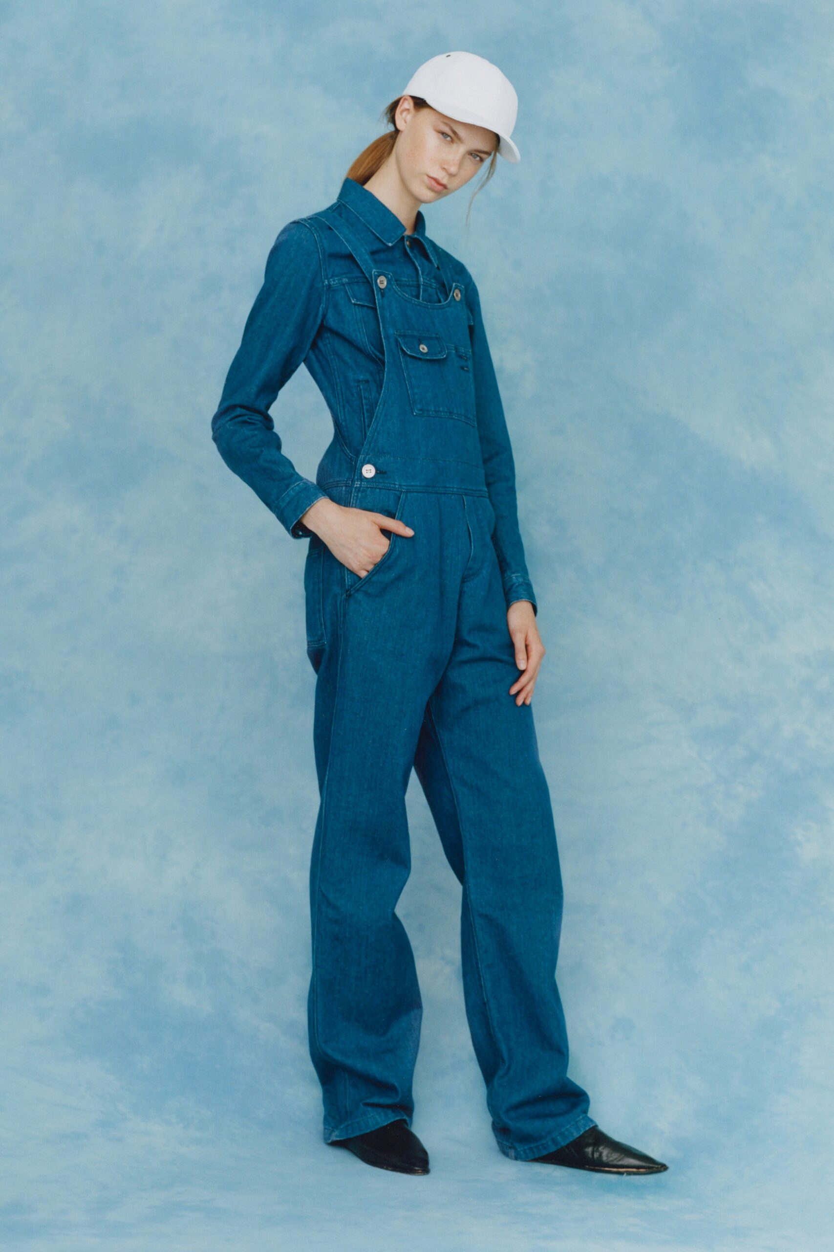 blue denim overalls with white hat