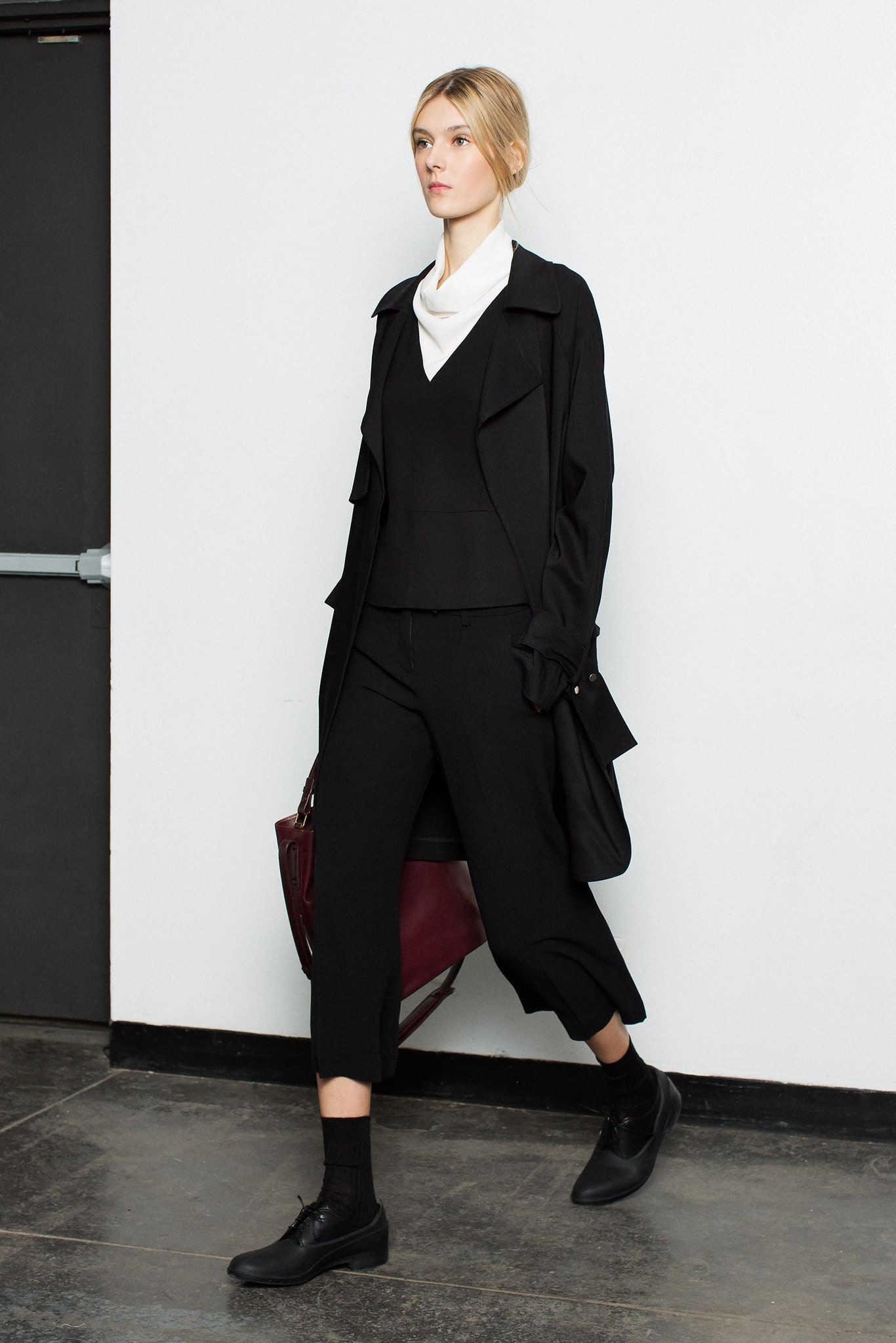 black relaxed coat and fitted top