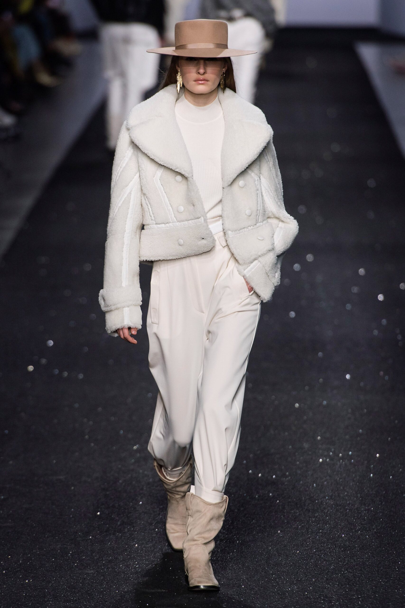 white faux-fur jacket with relaxed pants