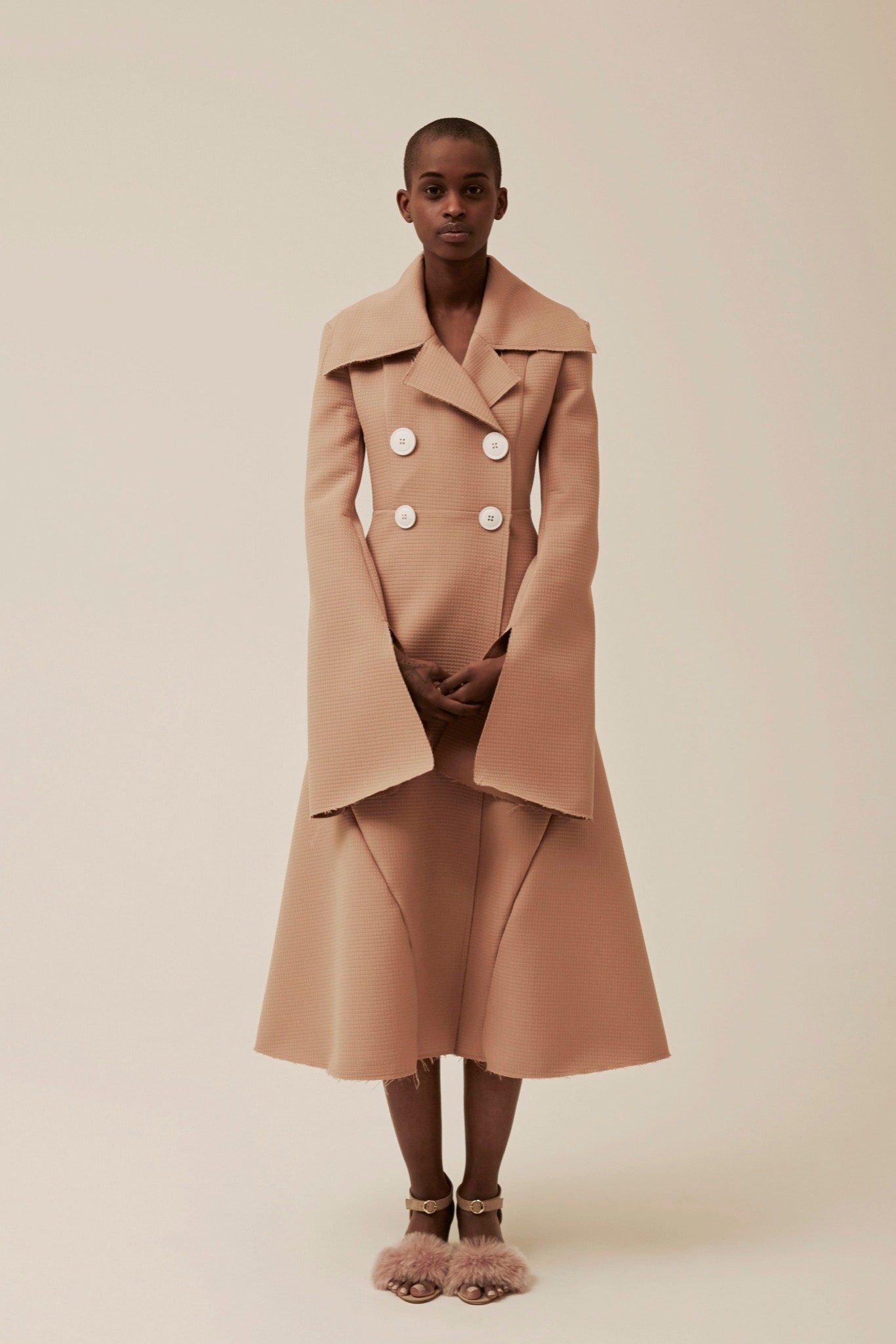 beige fitted coat with asymmetric design