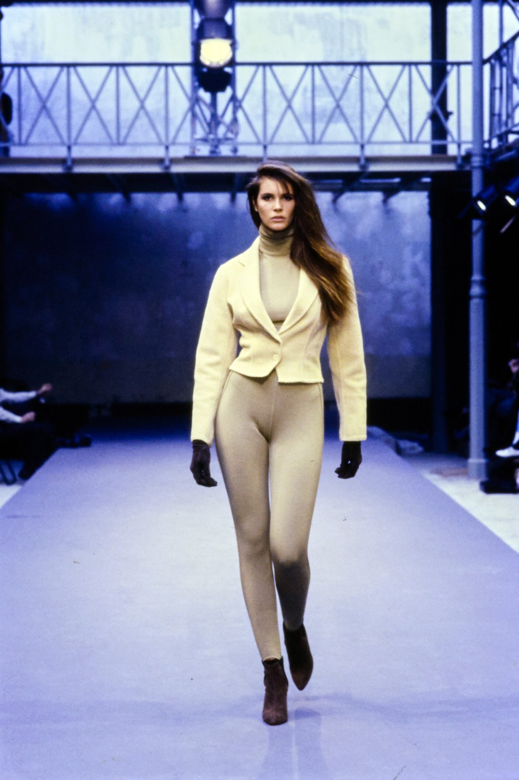 fitted yellow blazer and beige catsuit