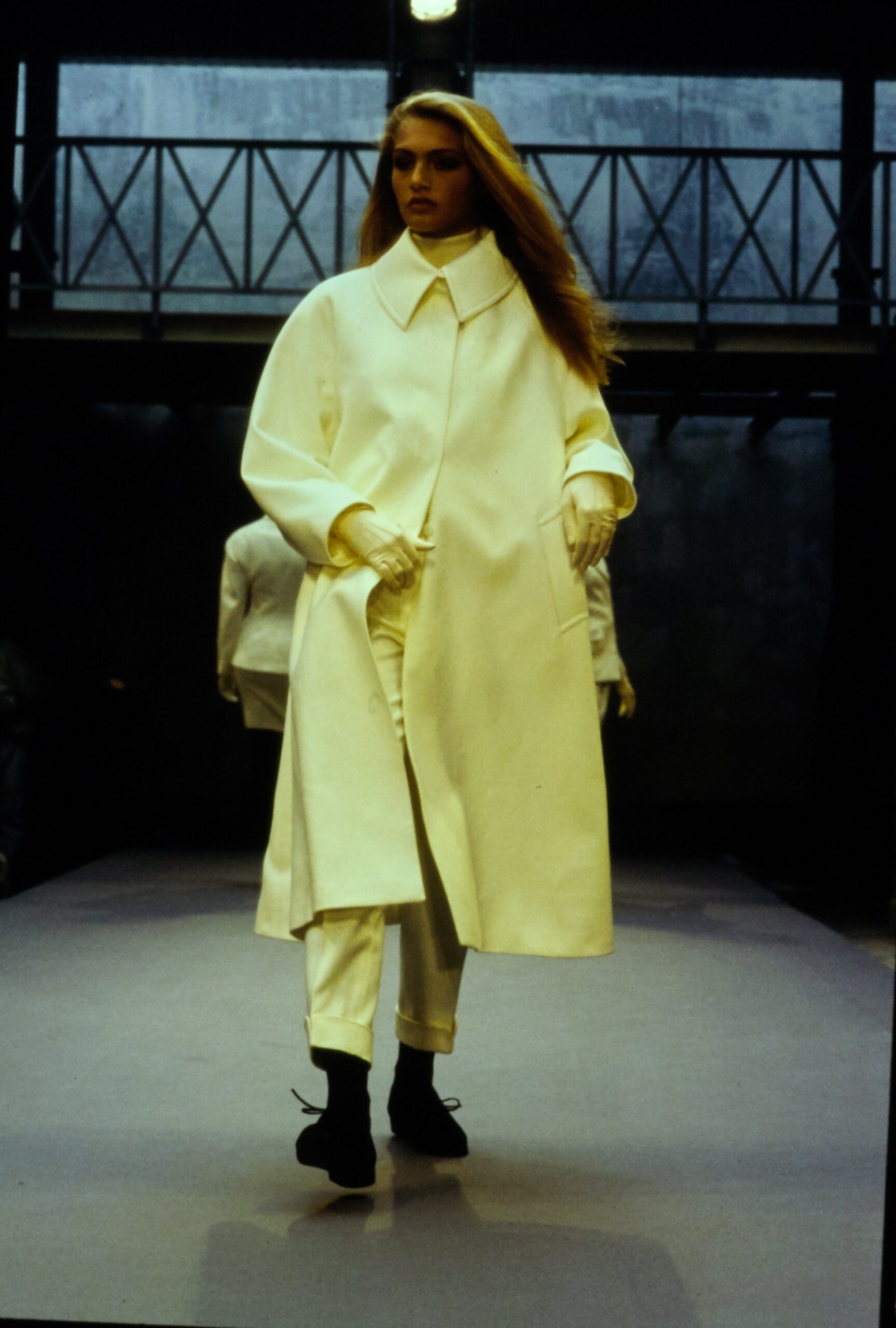 white wool coat with relaxed pants