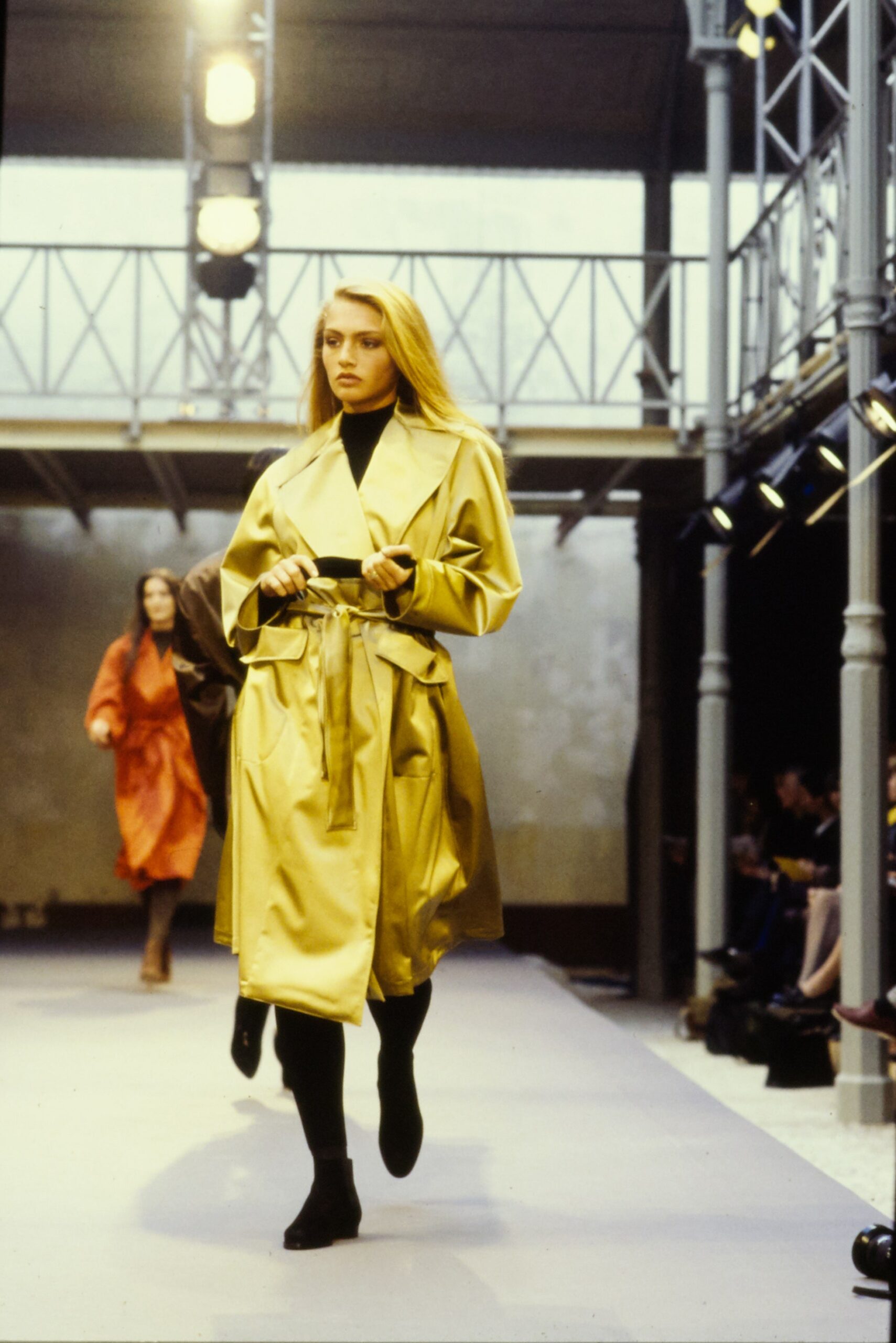 gold silk belted coat and black turtleneck
