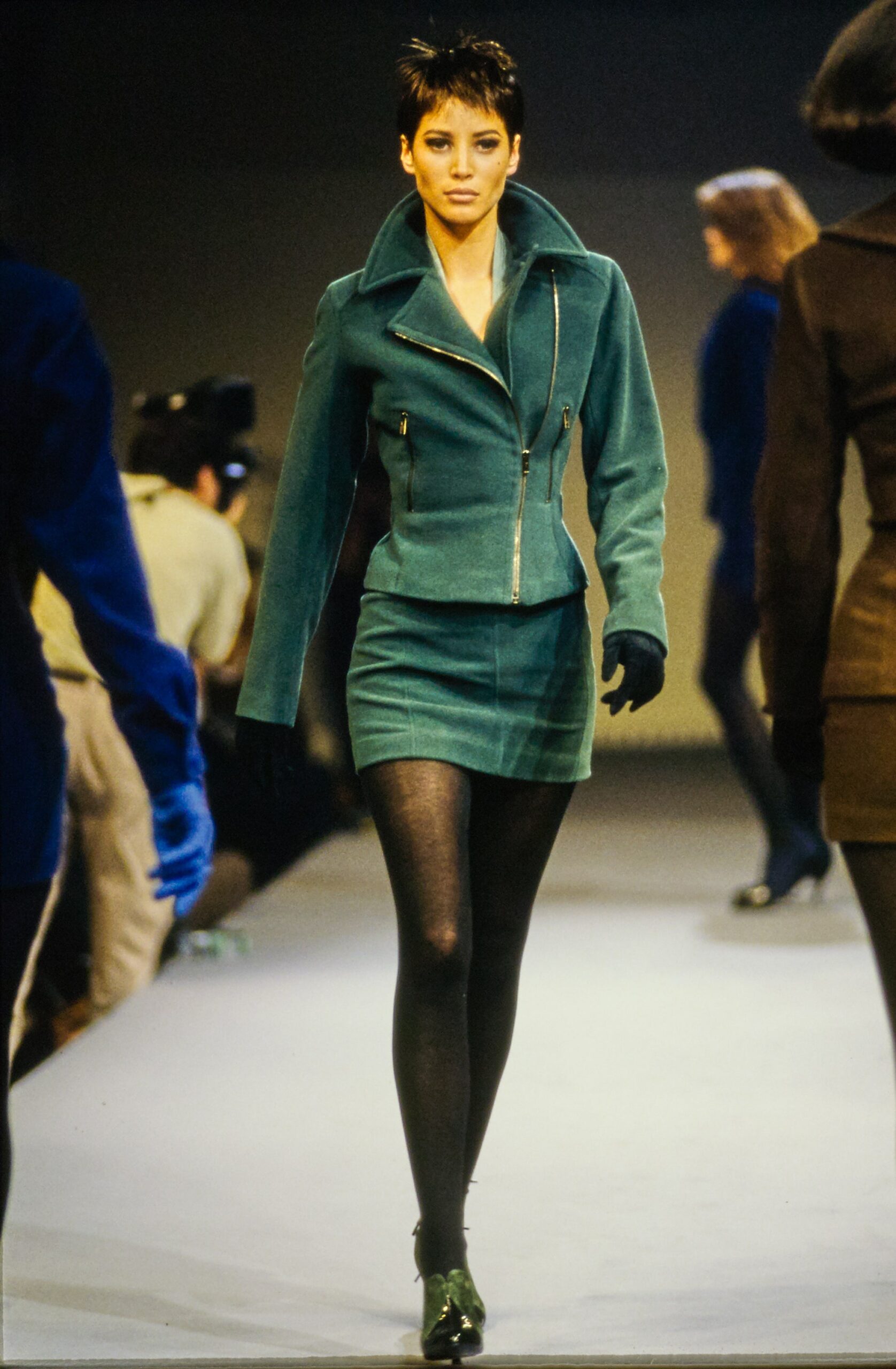 teal velvet fitted jacket and black mini skirt