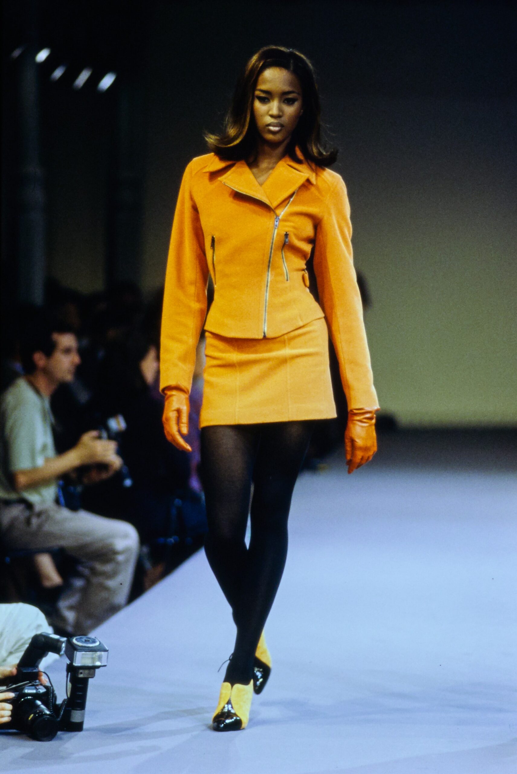 orange fitted jacket and mini skirt