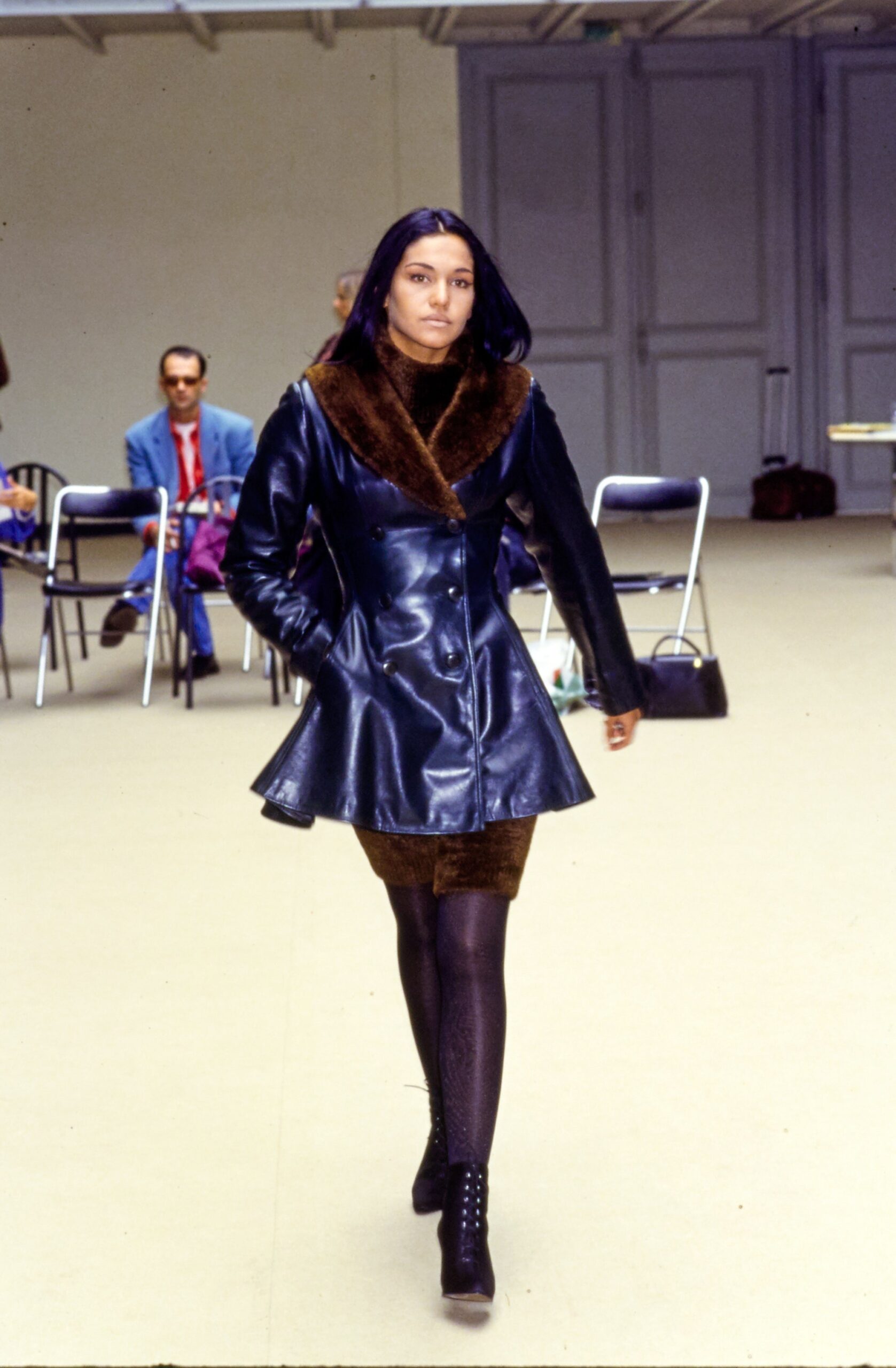 black leather coat with brown skirt