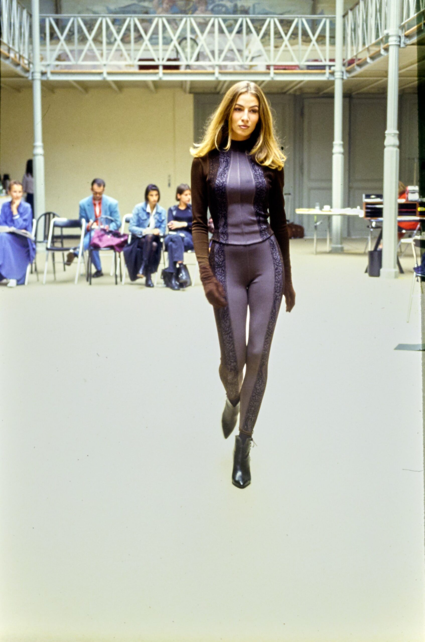 black fitted catsuit with boots