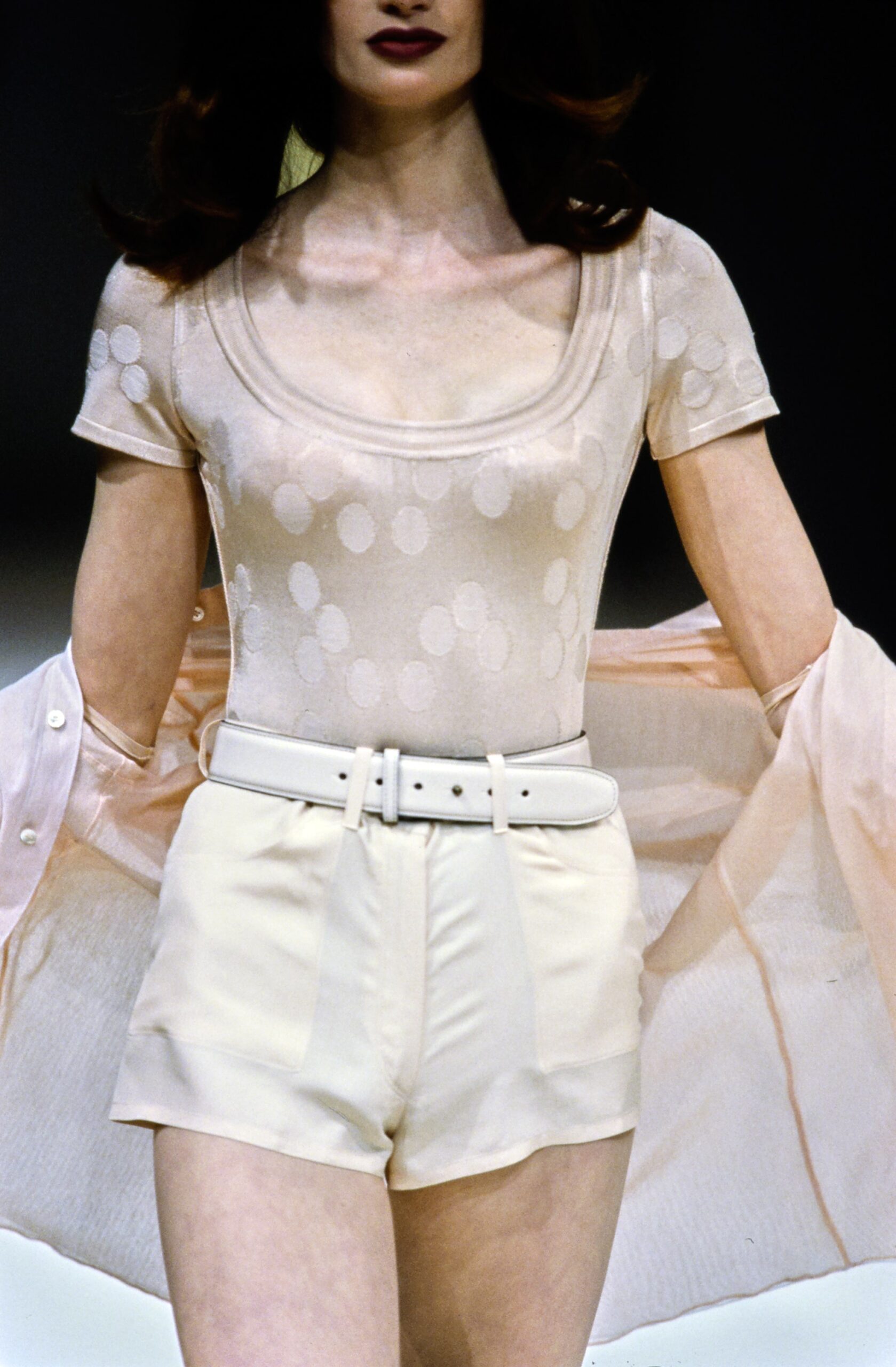 beige bodysuit with white shorts