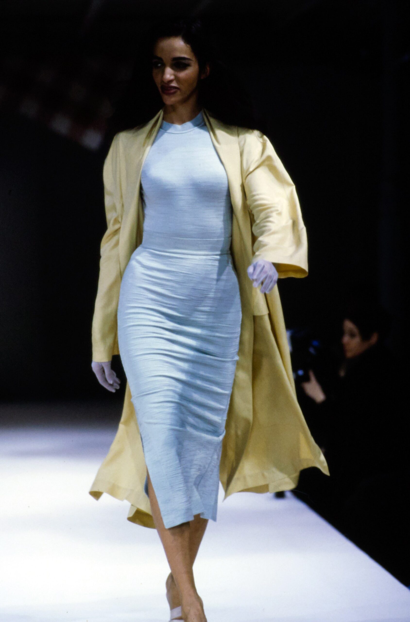 blue fitted midi dress with yellow coat
