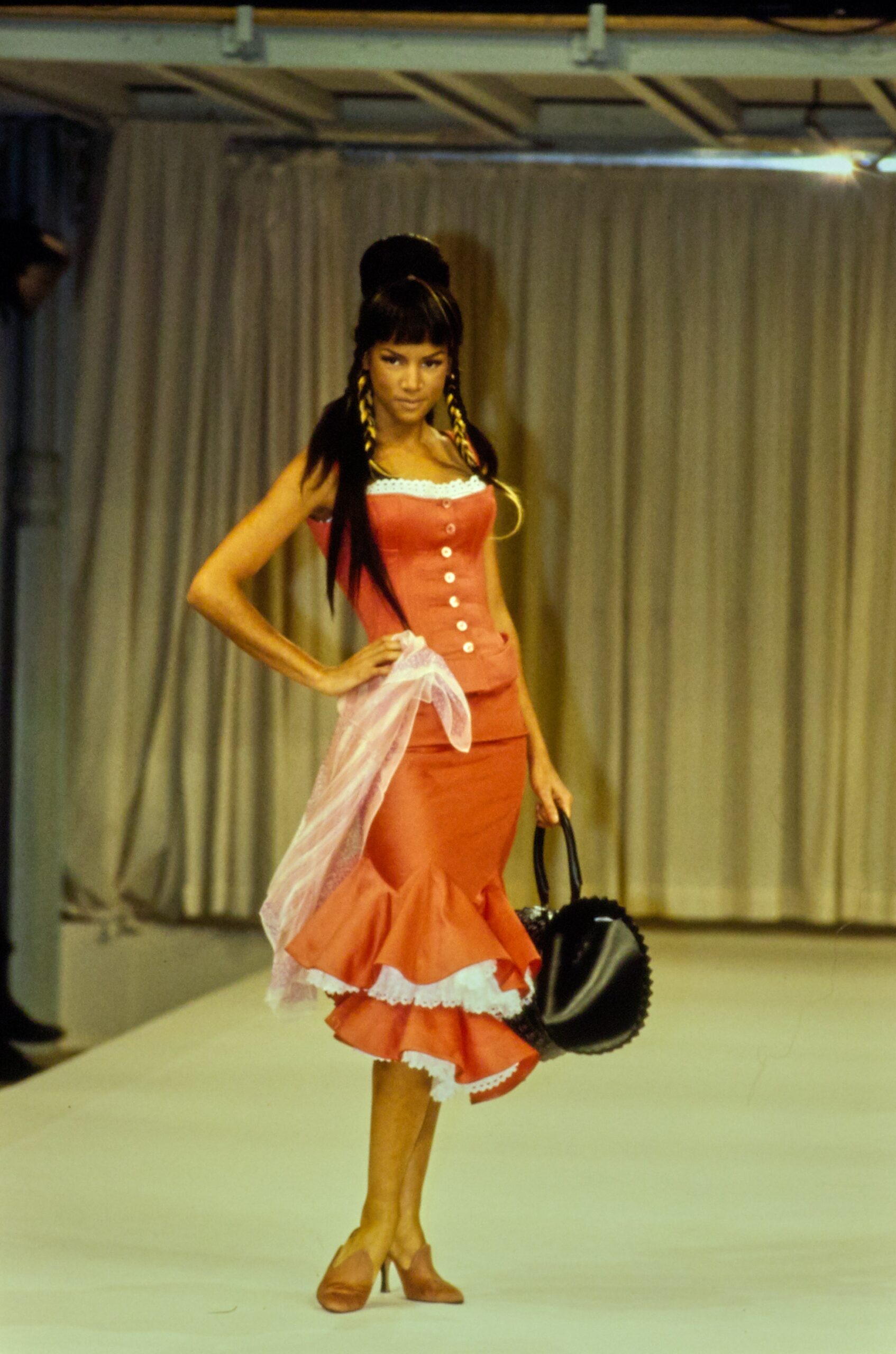 red sleeveless v-neck fitted buttoned ruffled top