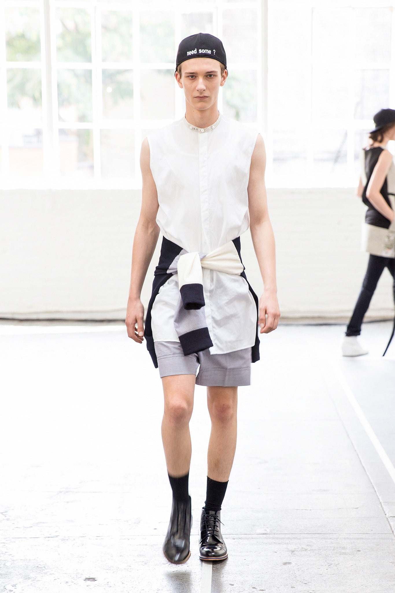 white sleeveless shirt with gray shorts