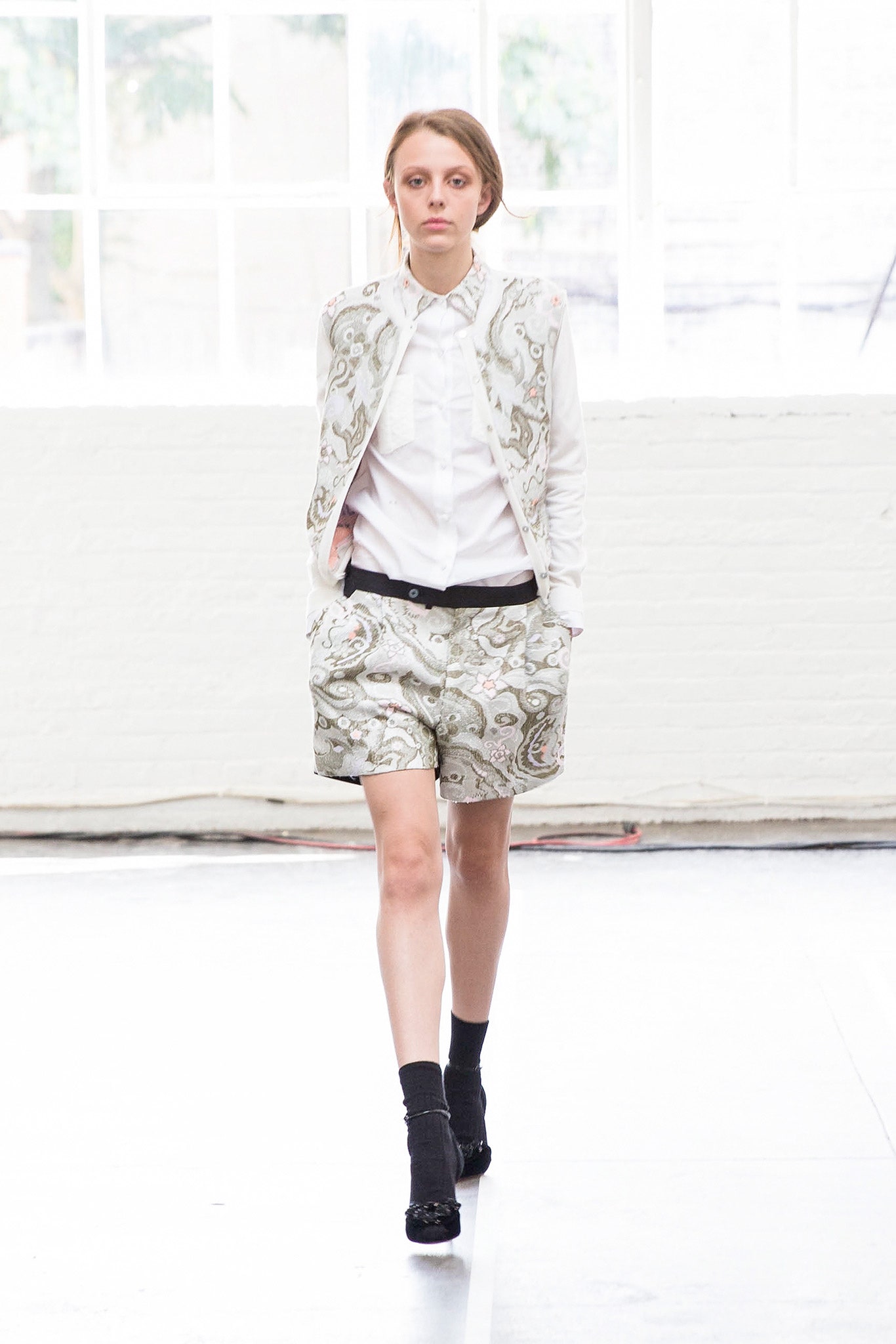 white blazer and printed shorts