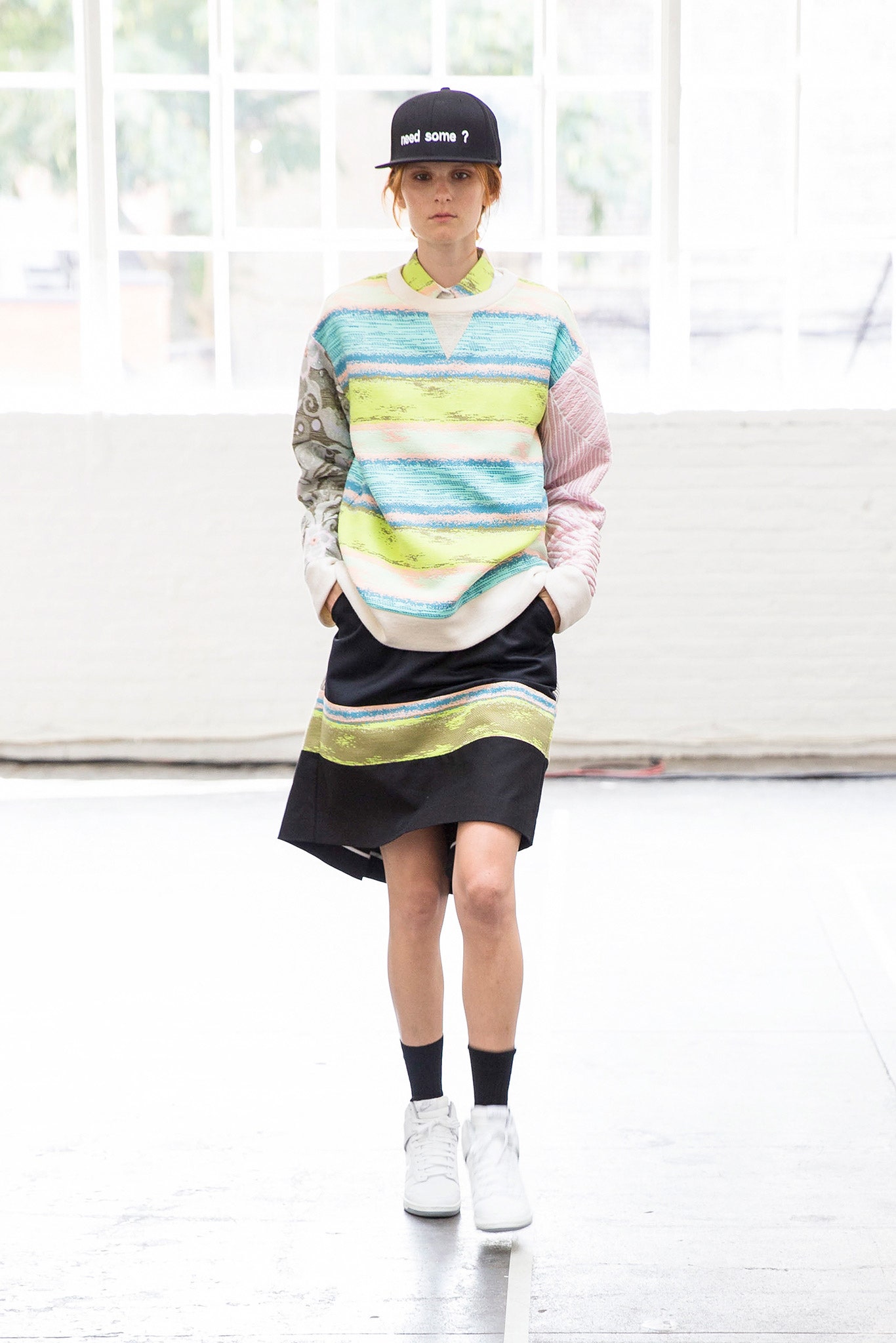 multi-colored relaxed sweater with black skirt