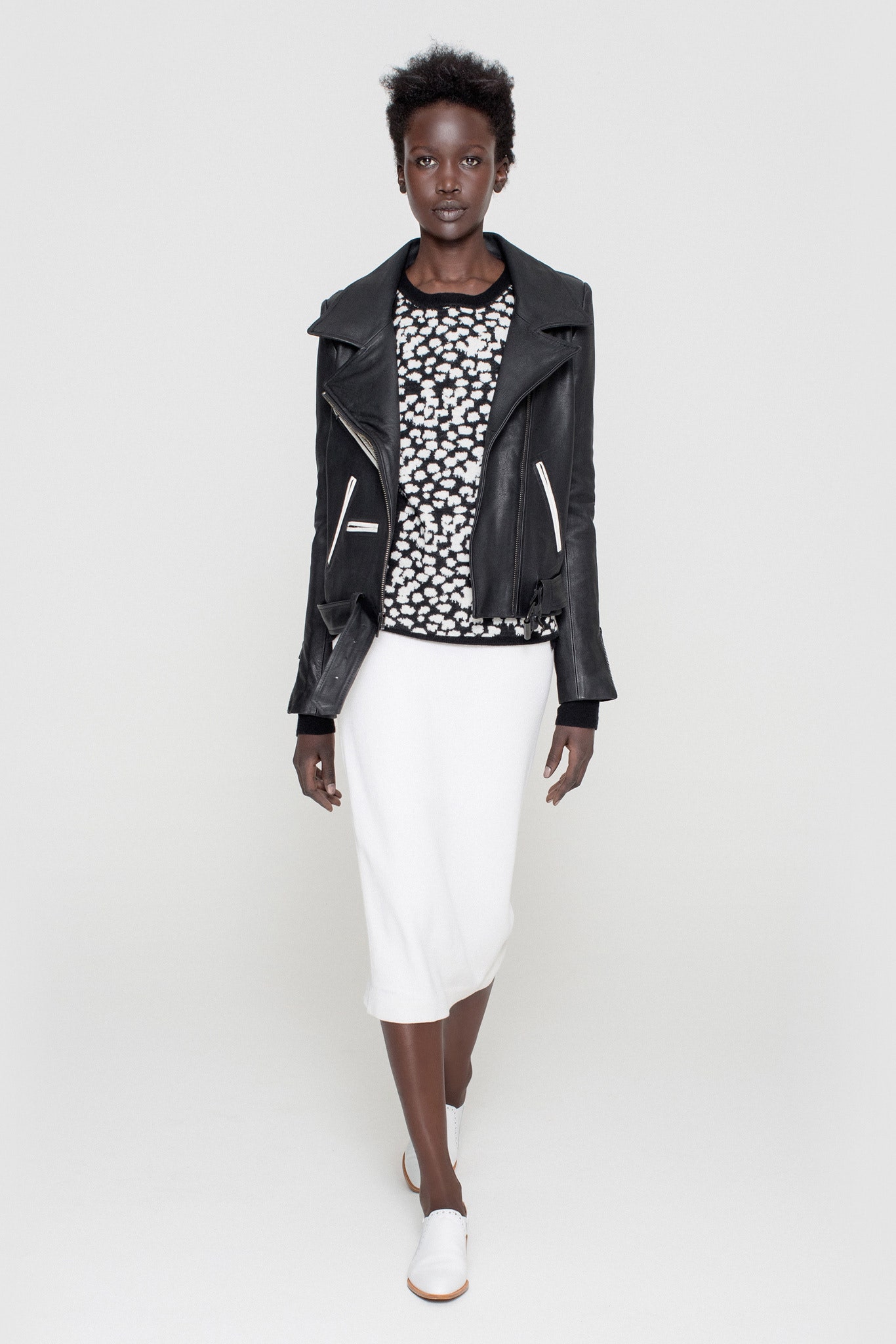 black leather jacket with printed top and white pencil skirt