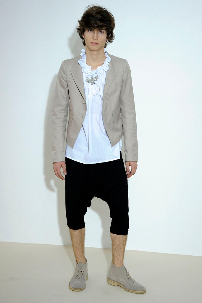 beige tailored blazer with ruffled shirt