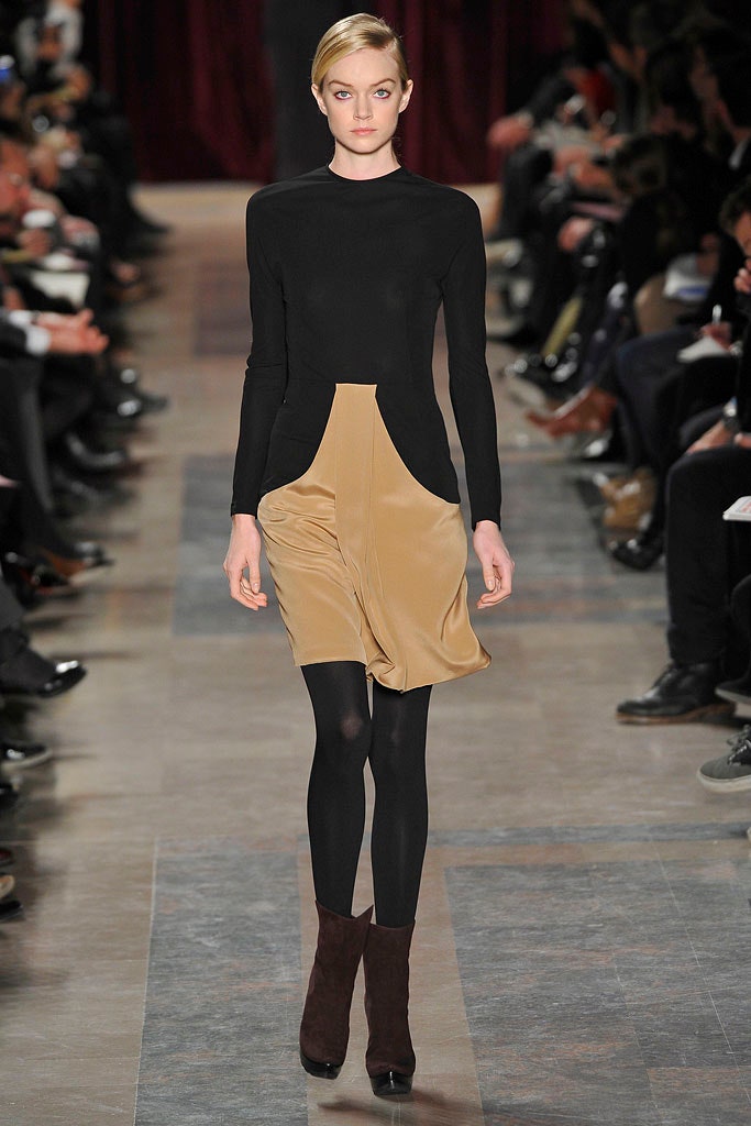 black fitted top with beige skirt