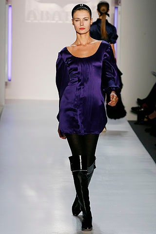 fitted purple silk top with black boots