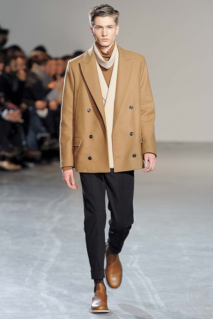 brown tailored coat with black pants