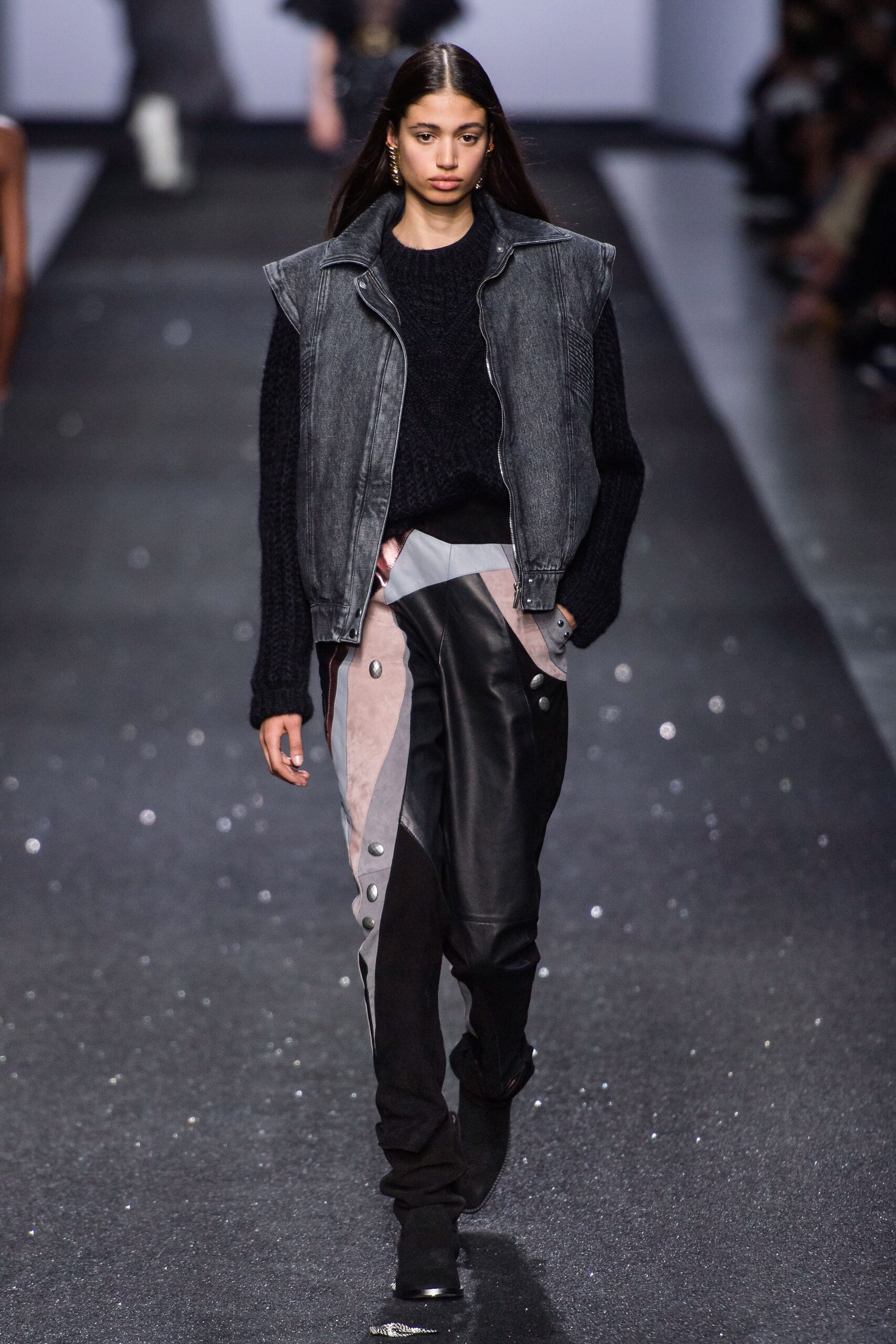 gray denim vest black sweater leather pants