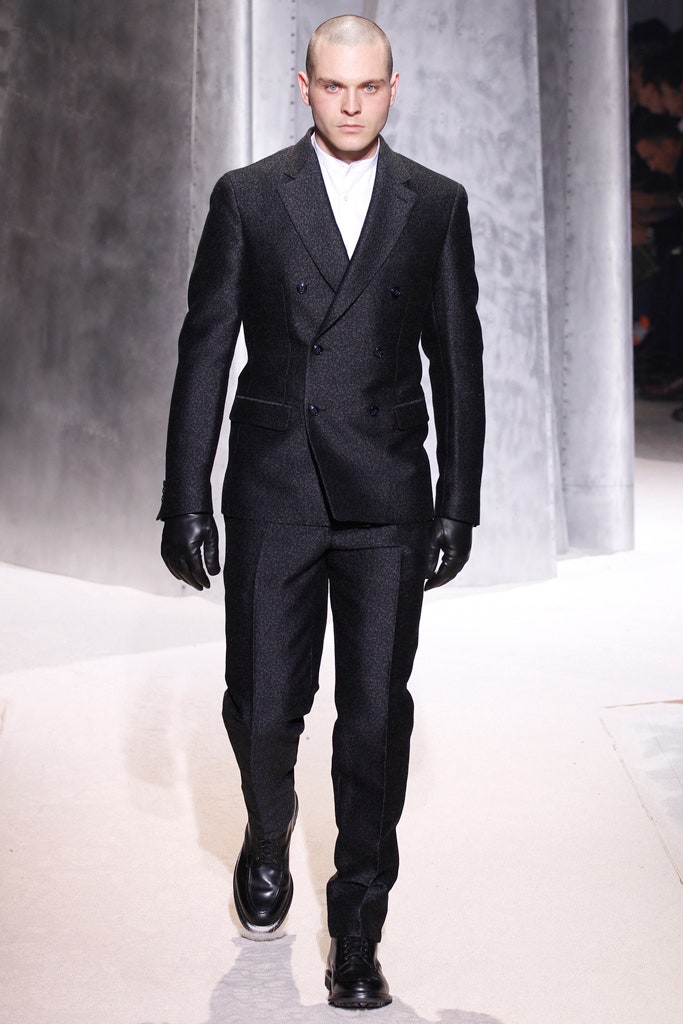 black tailored suit with gloves