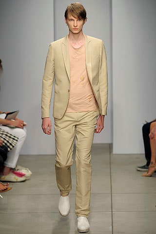 beige tailored suit with pink t-shirt