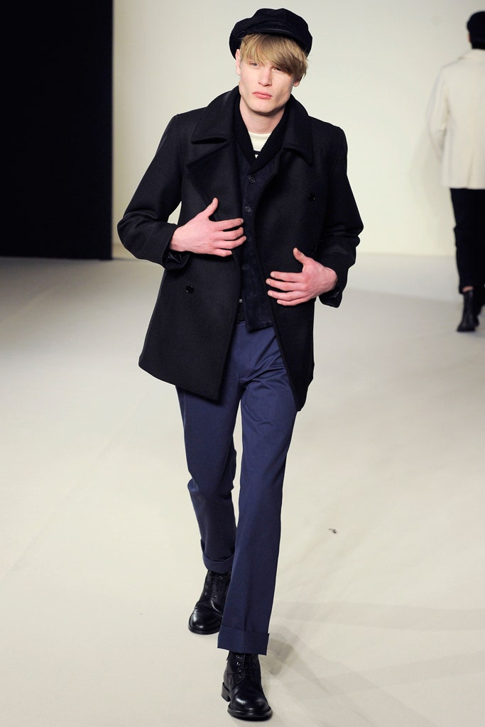 black wool coat with blue pants