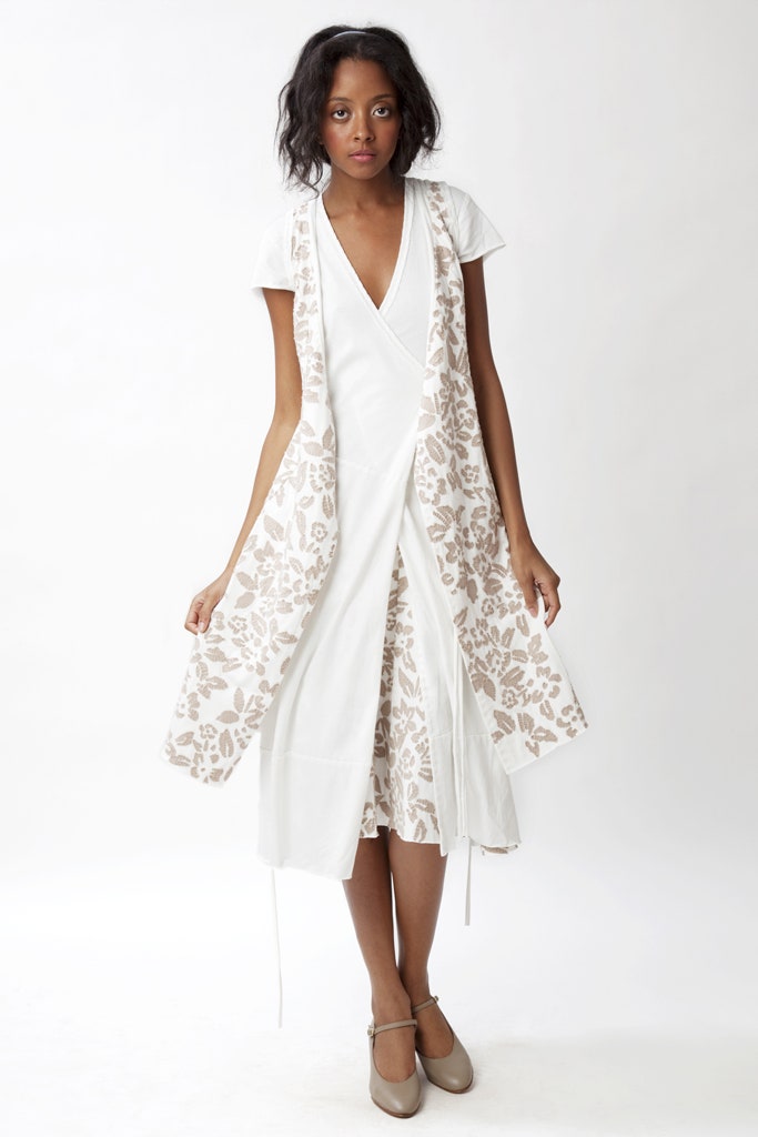 white fitted dress with beige coat