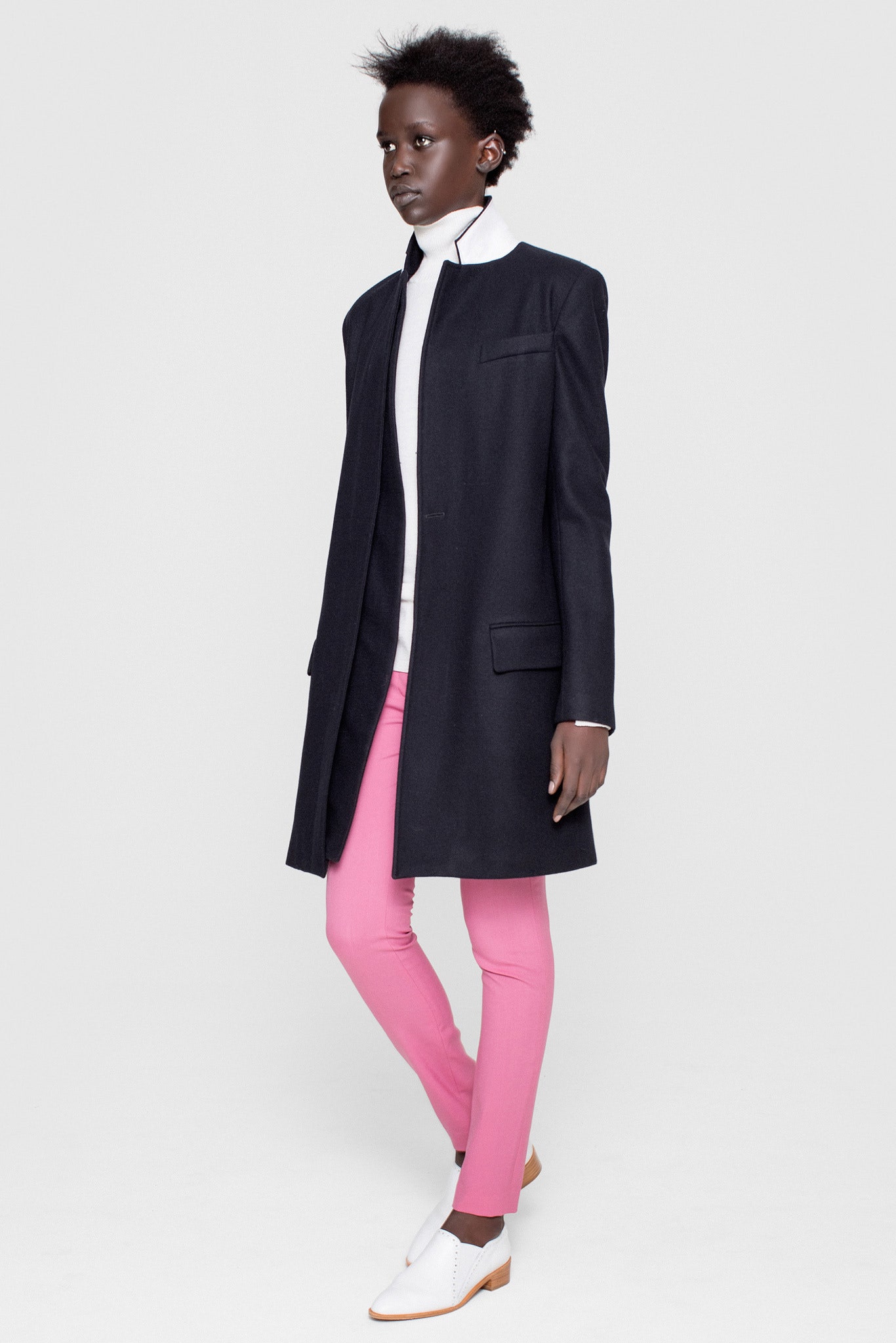 black wool coat with pink pants
