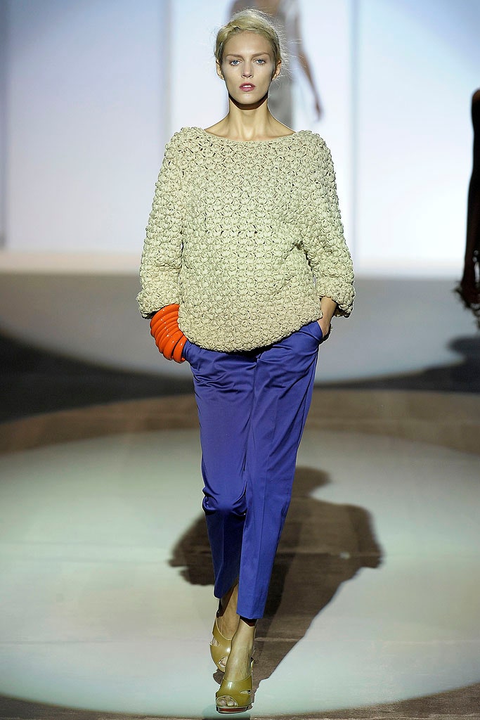 beige crochet sweater with blue pants