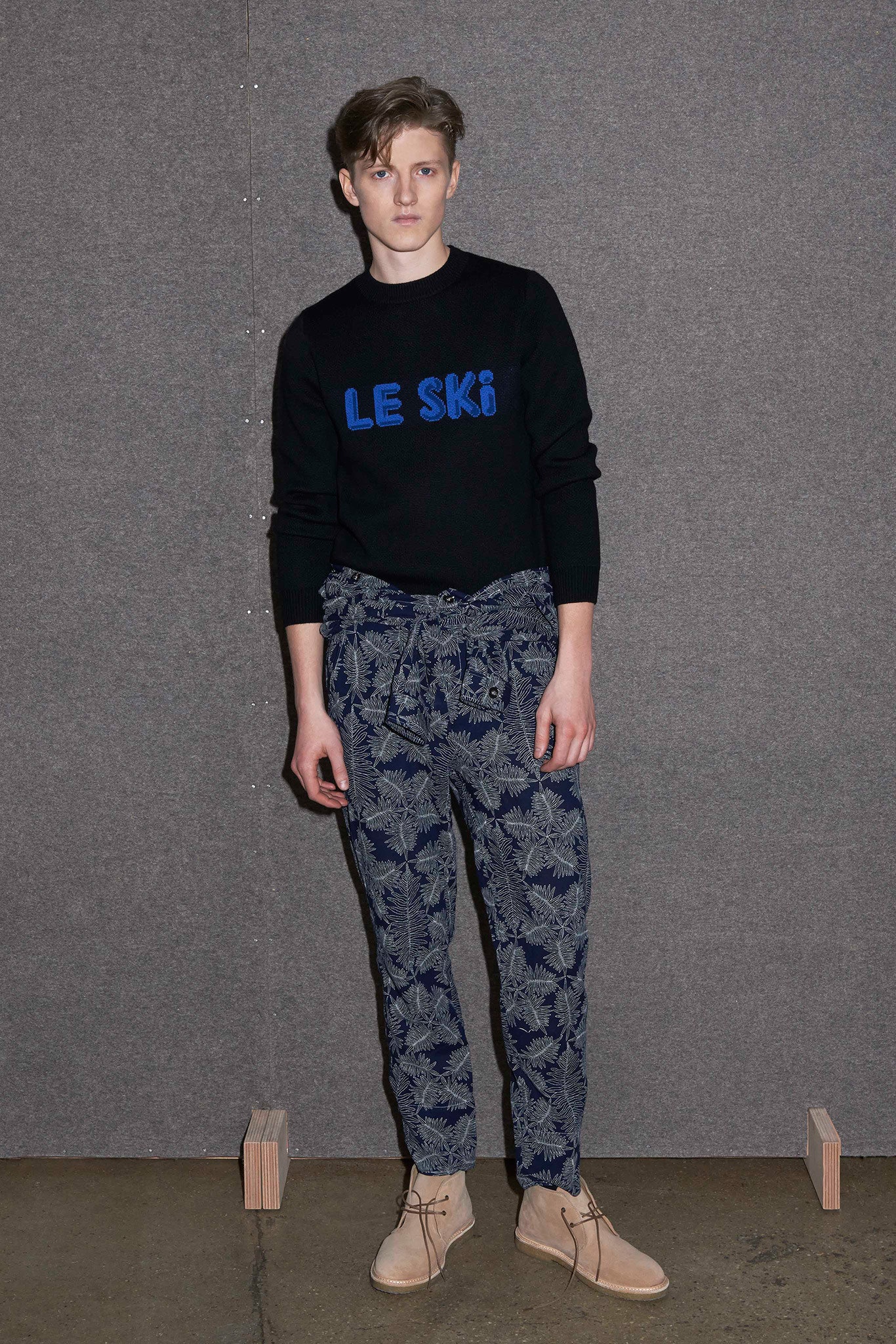 black sweater blue printed pants