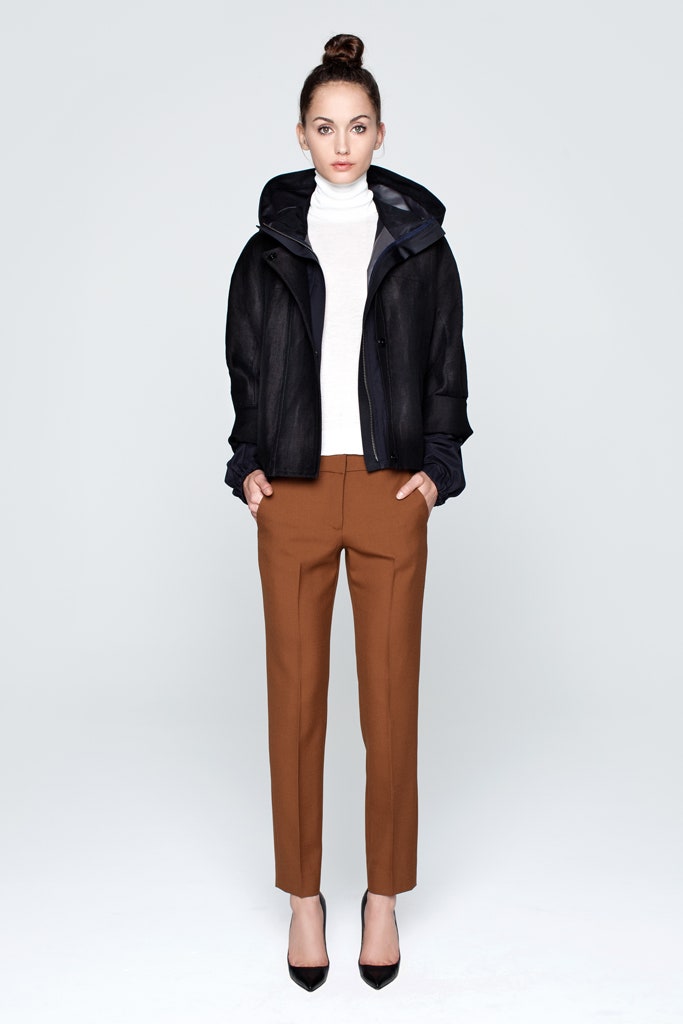 black jacket white turtleneck brown pants