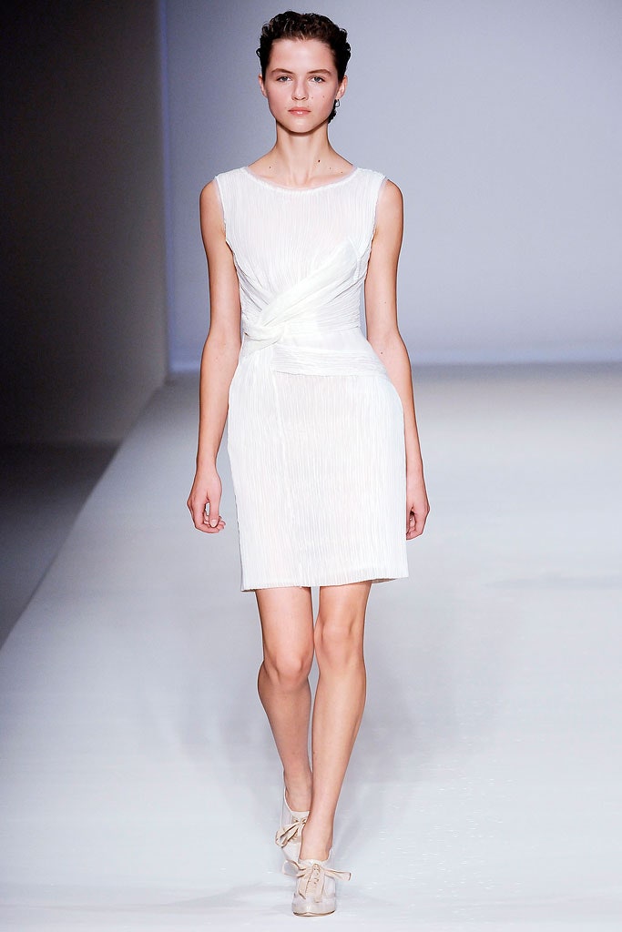 white pleated sleeveless dress
