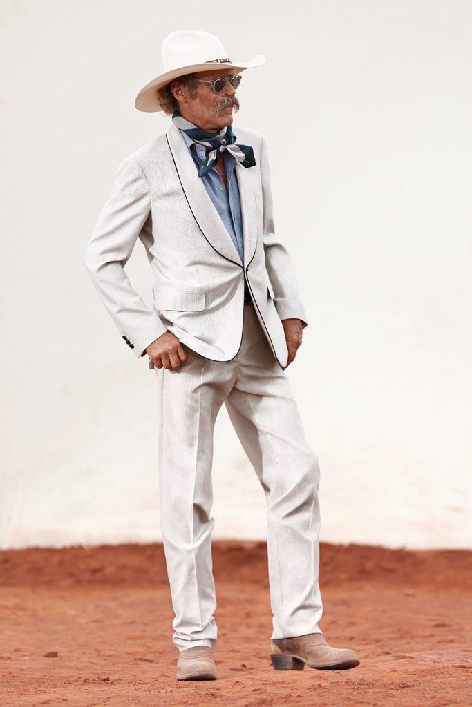 white tailored suit with blue shirt