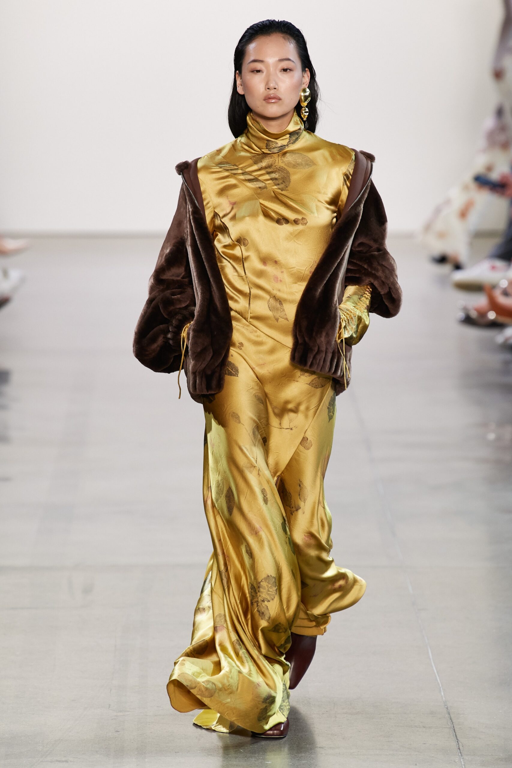 gold silk maxi dress with brown coat