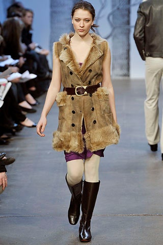 brown faux-fur vest with purple dress