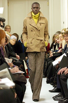 beige jacket yellow sweater brown pants