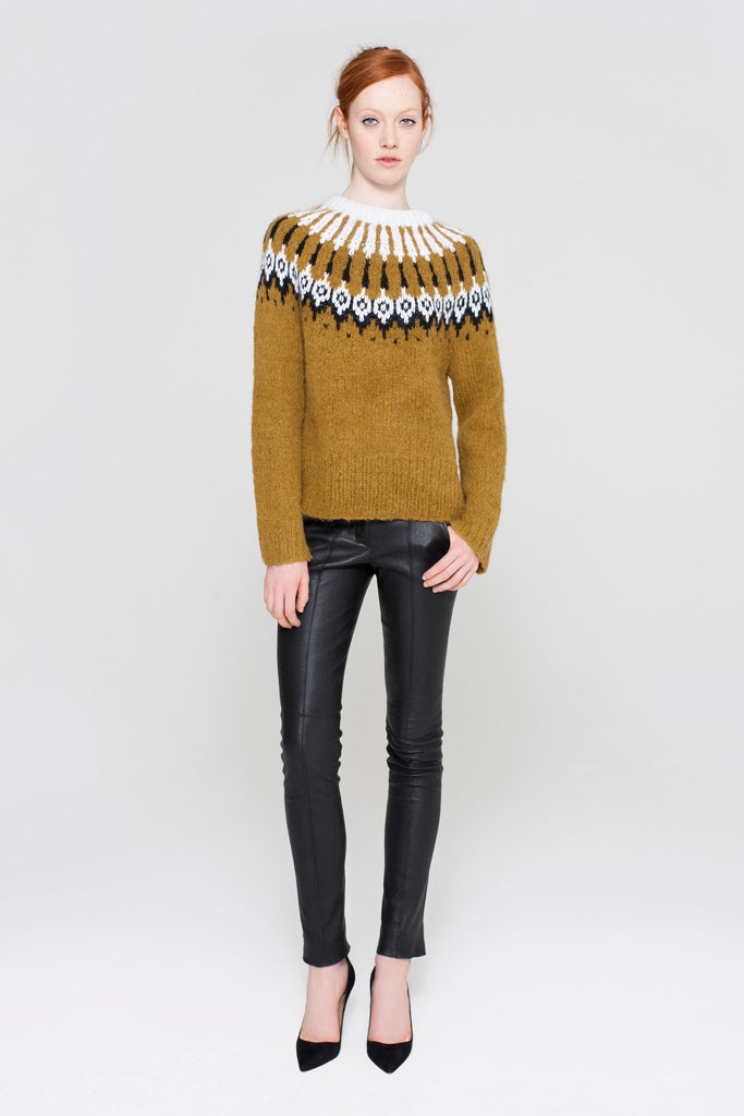 brown embroidered sweater with black pants