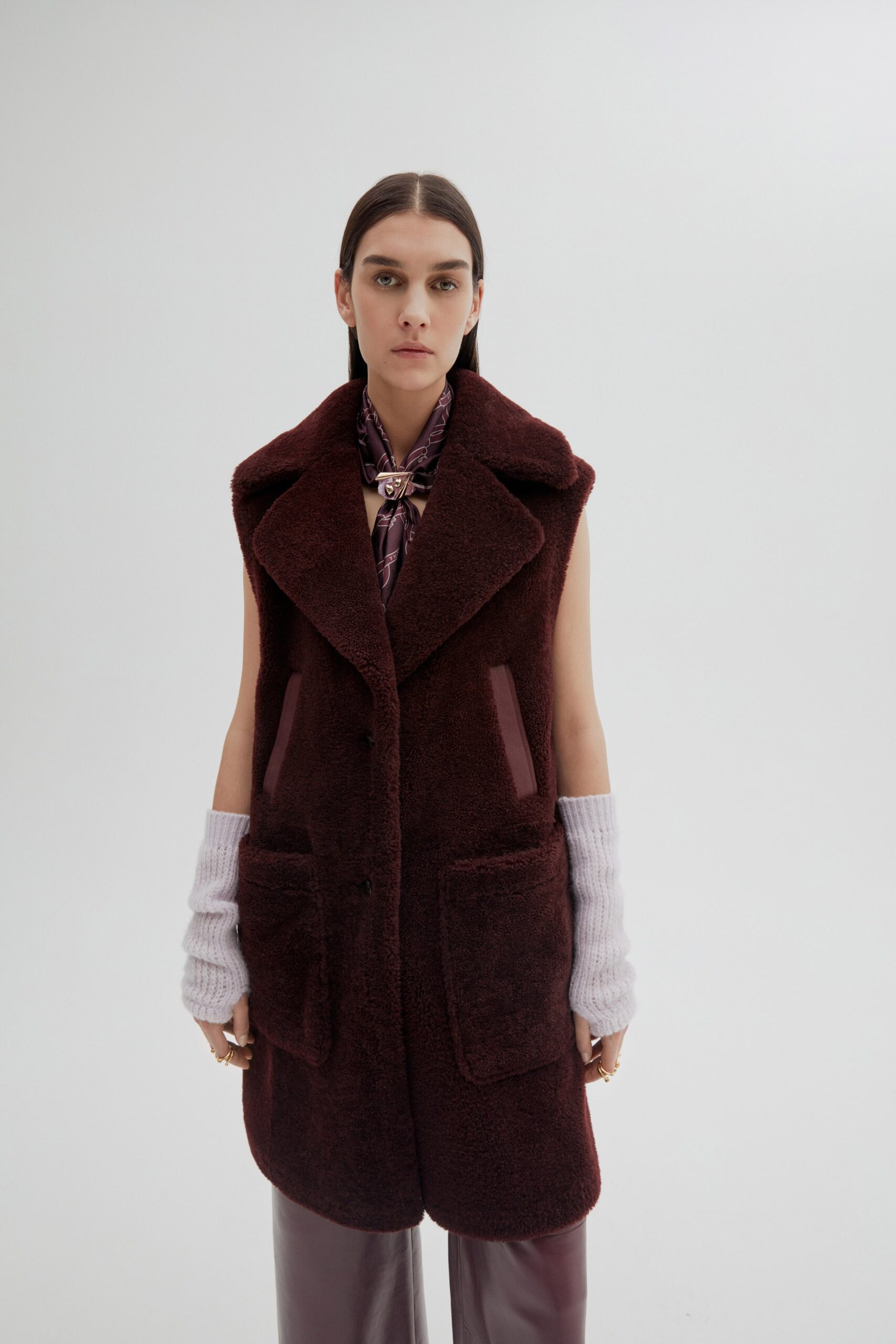 maroon faux-fur vest with purple blouse