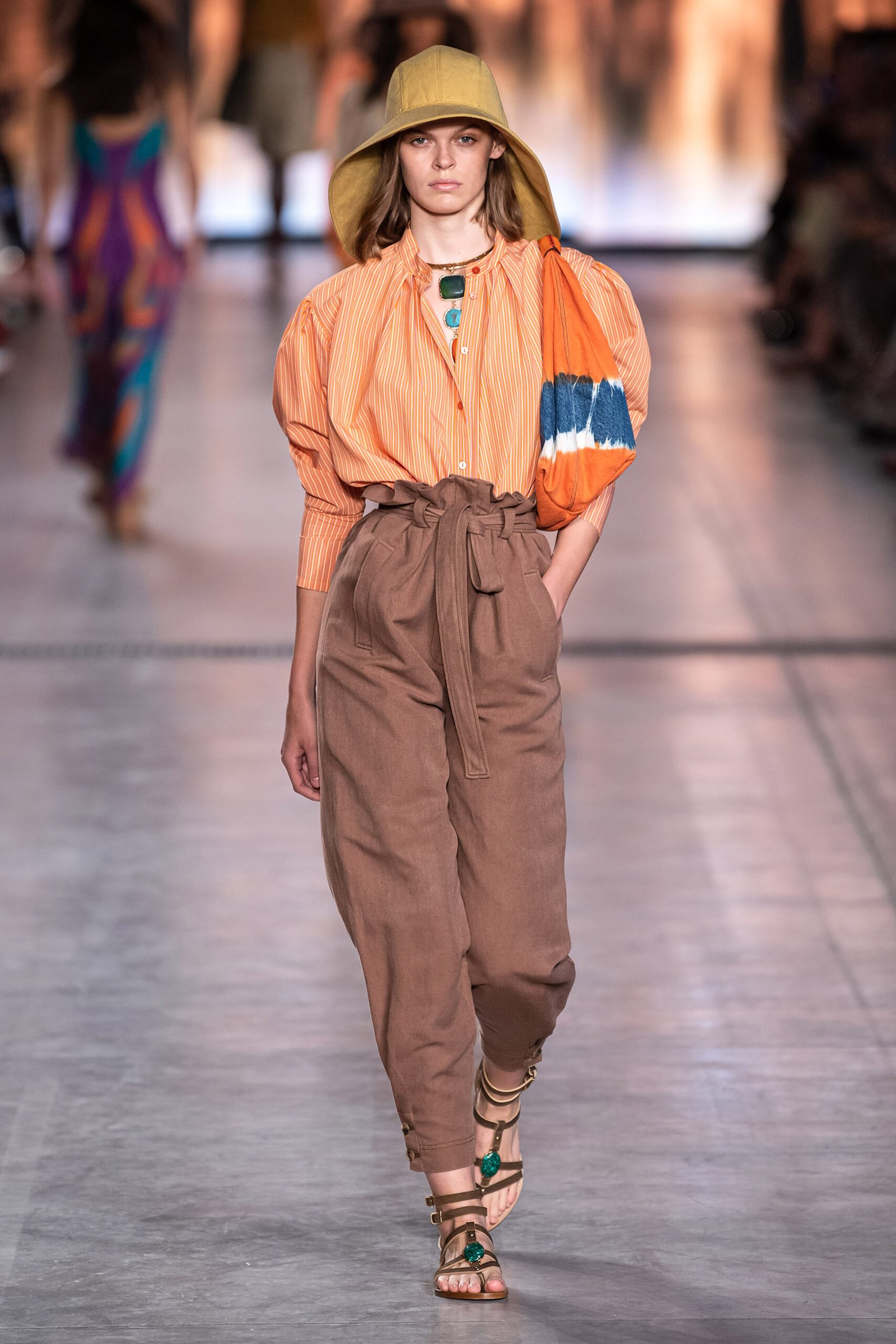 orange striped shirt with brown pants