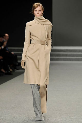 beige wool belted coat with gray pants