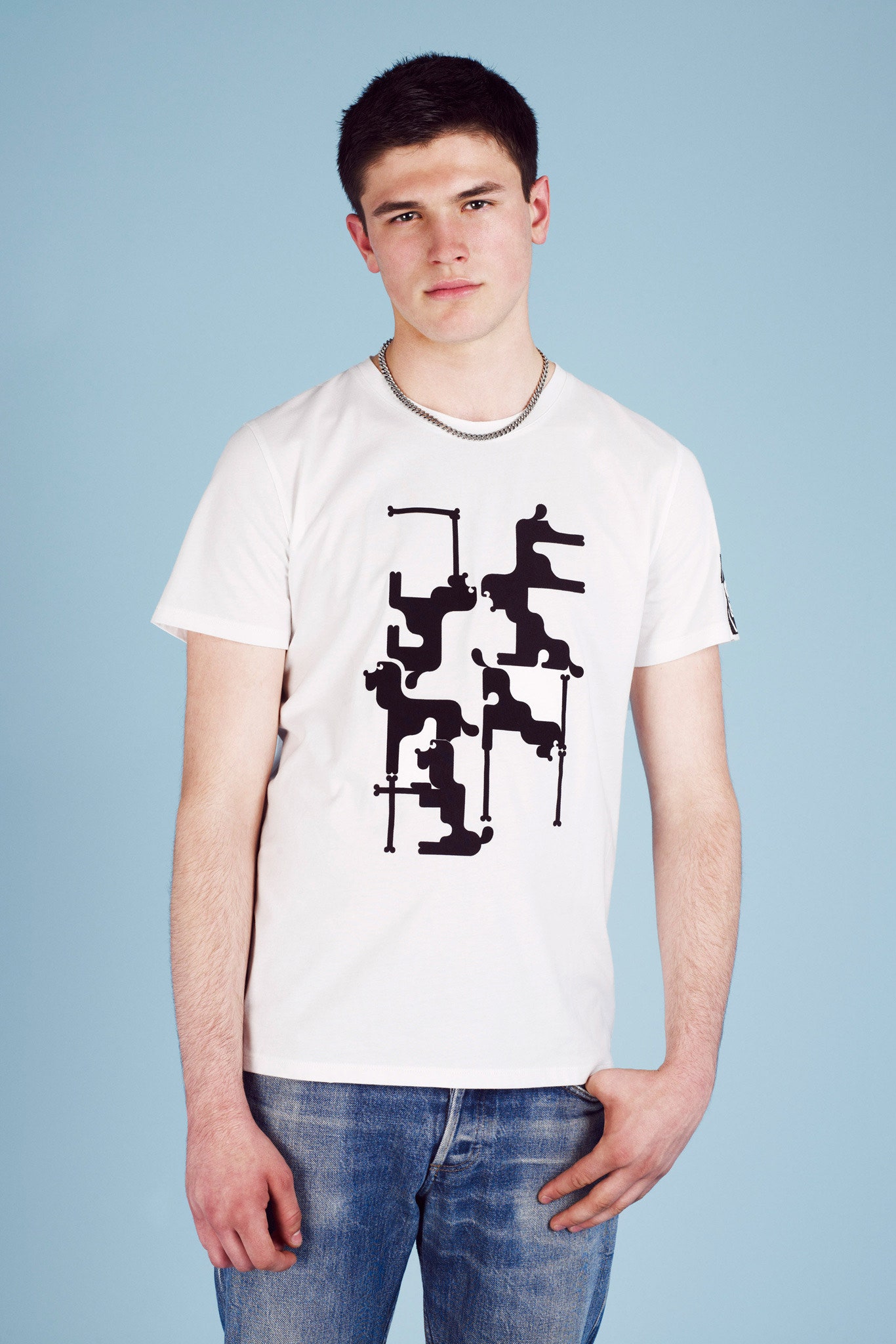 white printed t-shirt and blue jeans