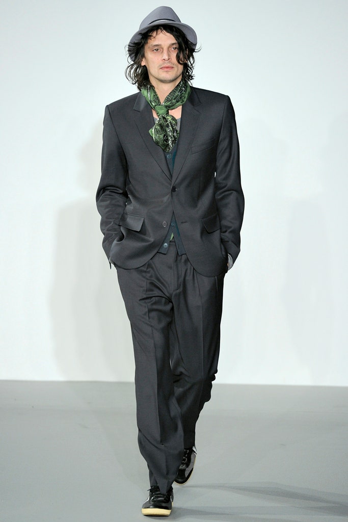 black tailored suit with green shirt