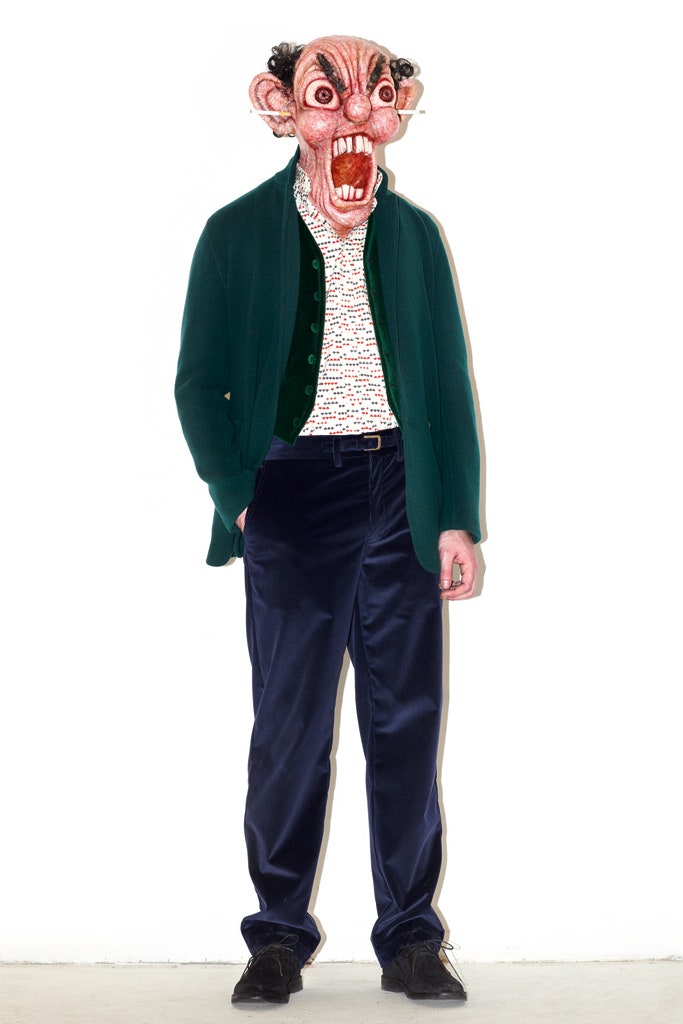 green jacket white shirt blue pants