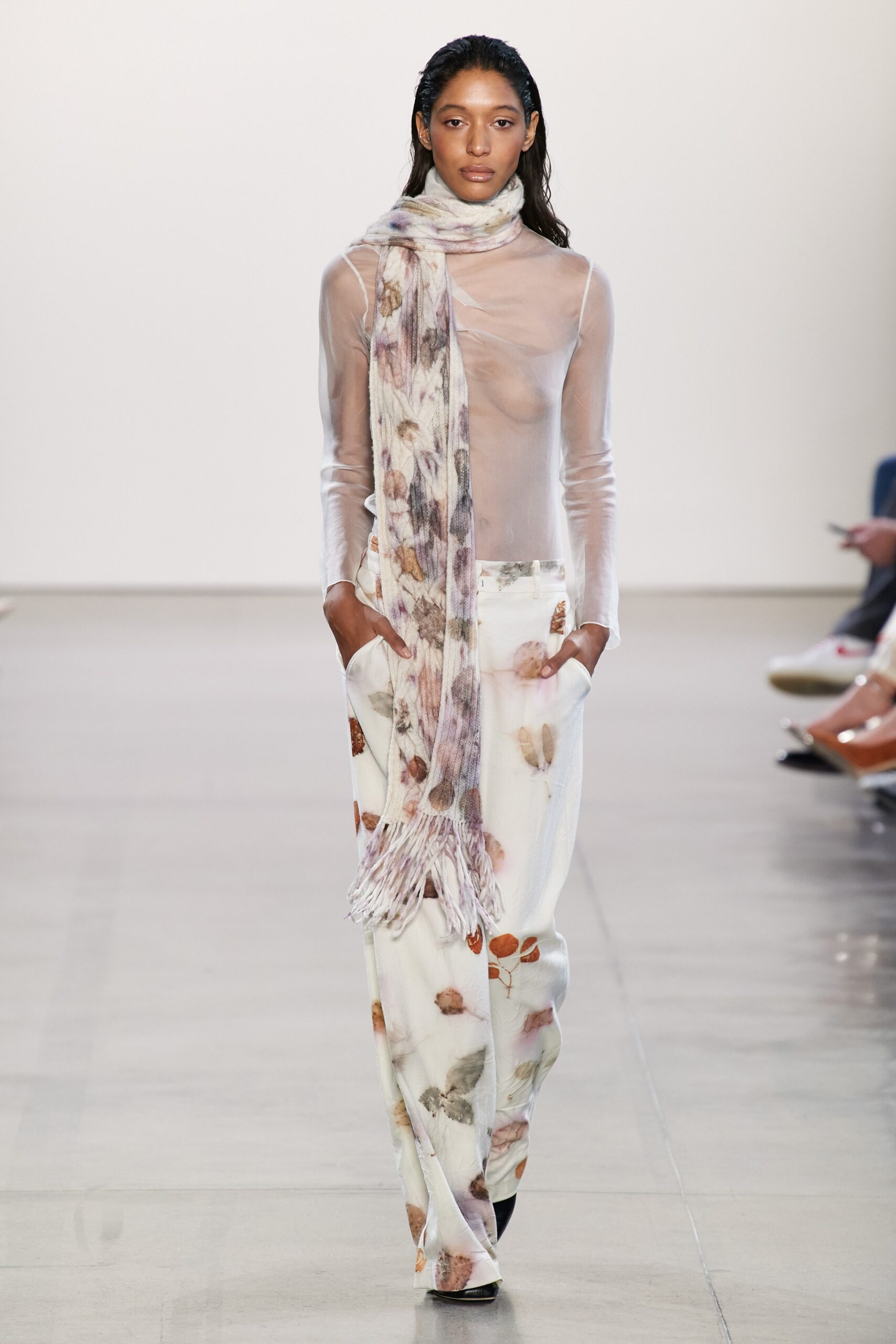 sheer white top with flared pants