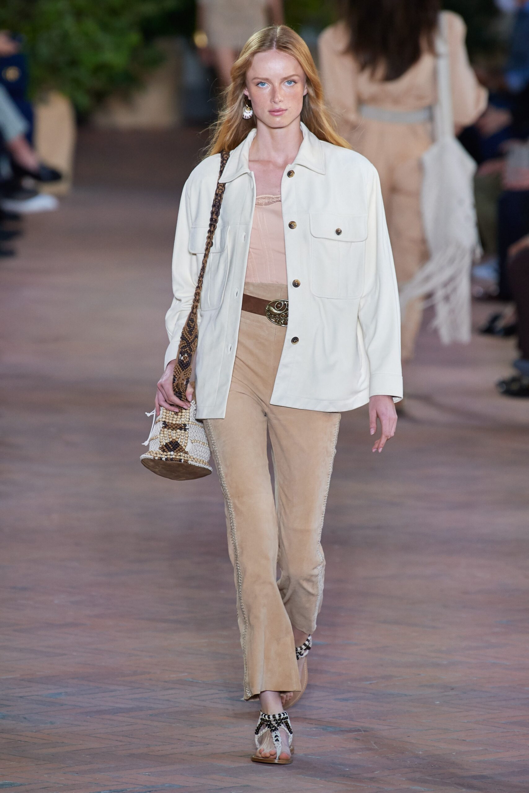white jacket beige top and pants