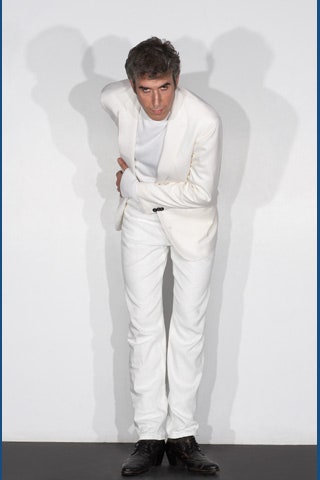 white tailored suit with black shoes