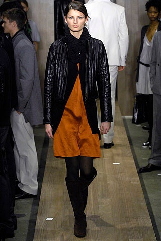 orange sleeveless dress with black jacket