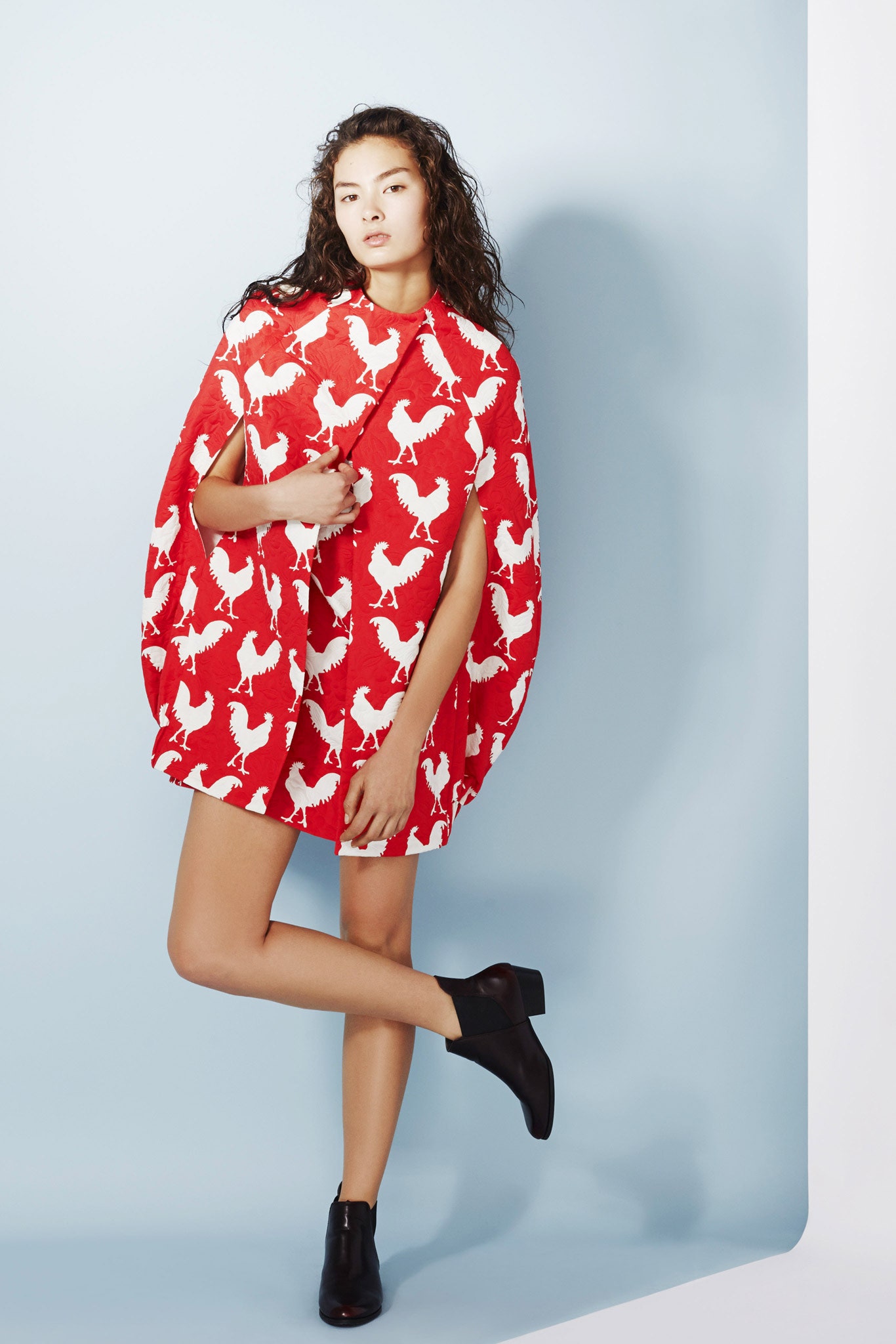 red printed cape and mini dress