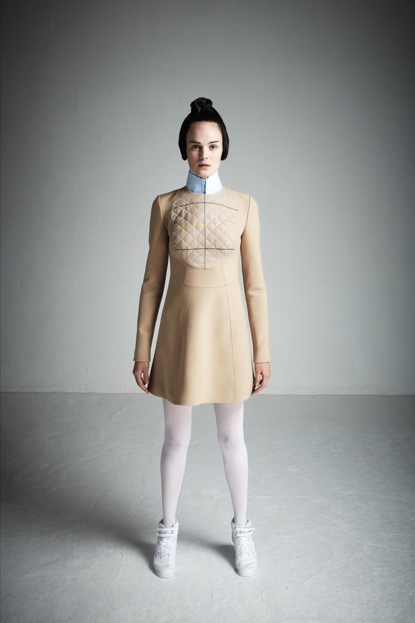 beige fitted mini dress with white shoes